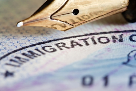 Pen and immigration paperwork