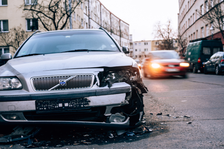ront-end crash damage is parked on a city street while vehicles pass by in the background. Thank you This image is for editorial use only This photo has been successfully downloaded. (Look for it in your Downloads folder or the last place you saved a file.
